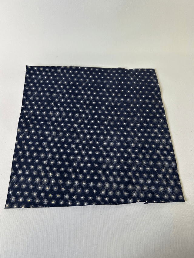 Chute de cuir bleu marine argenté pailleté