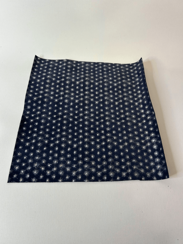 Chute de cuir bleu marine argenté pailleté