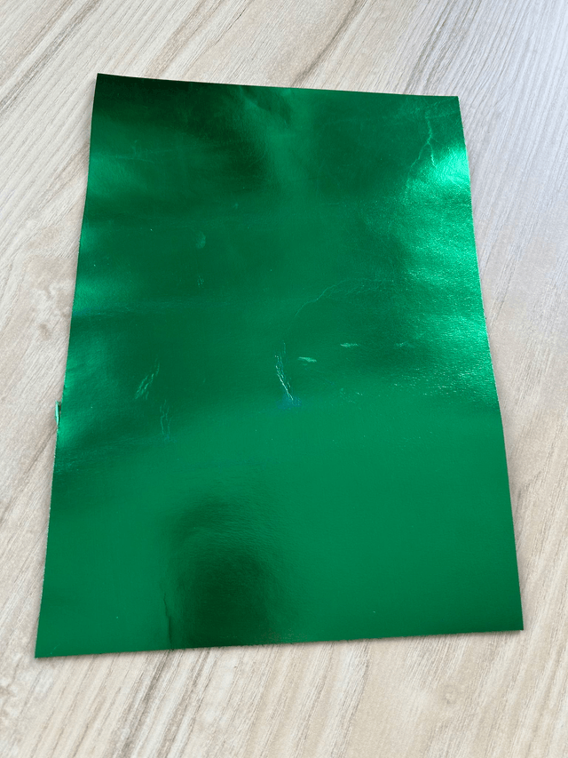 Chute de cuir vert métallisé miroir