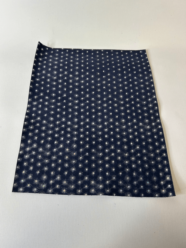 Chute de cuir bleu marine argenté pailleté